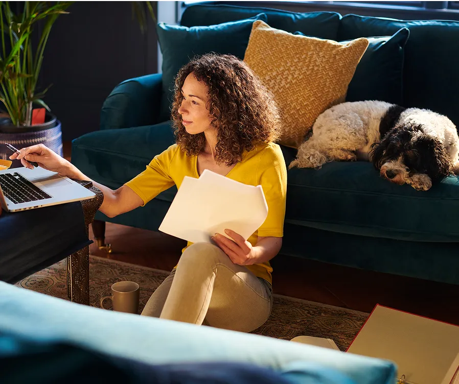 Woman sitting at a laptop on a desk