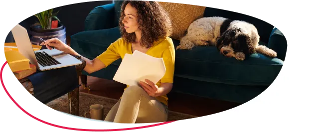 Woman sitting at a laptop on a desk