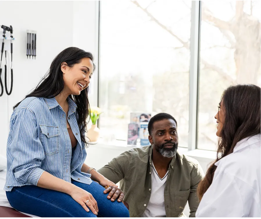Three people sitting and talking